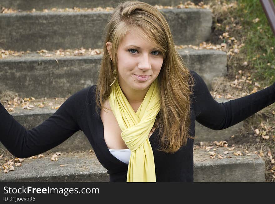 A beautiful teenage girl smiles for the camera. A beautiful teenage girl smiles for the camera