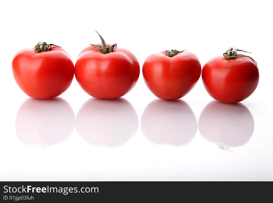 Tomatos in raw on a white background