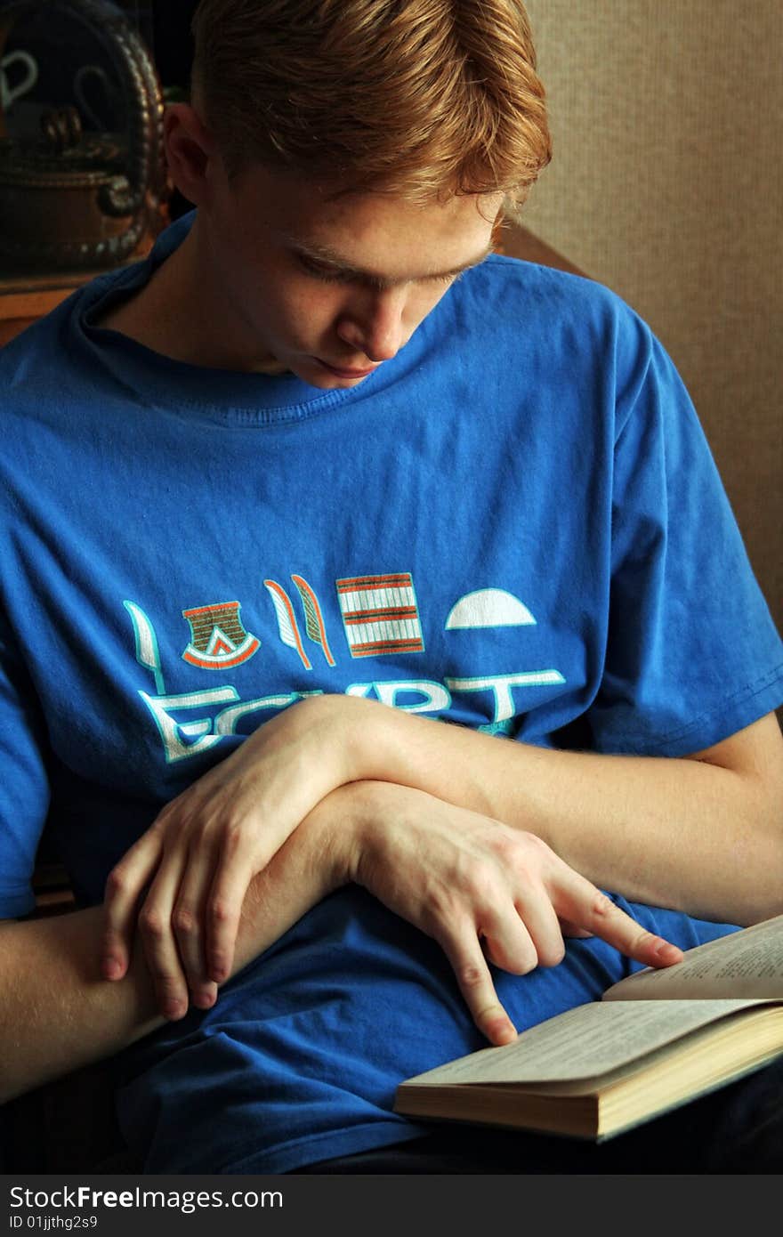 Young men reading book