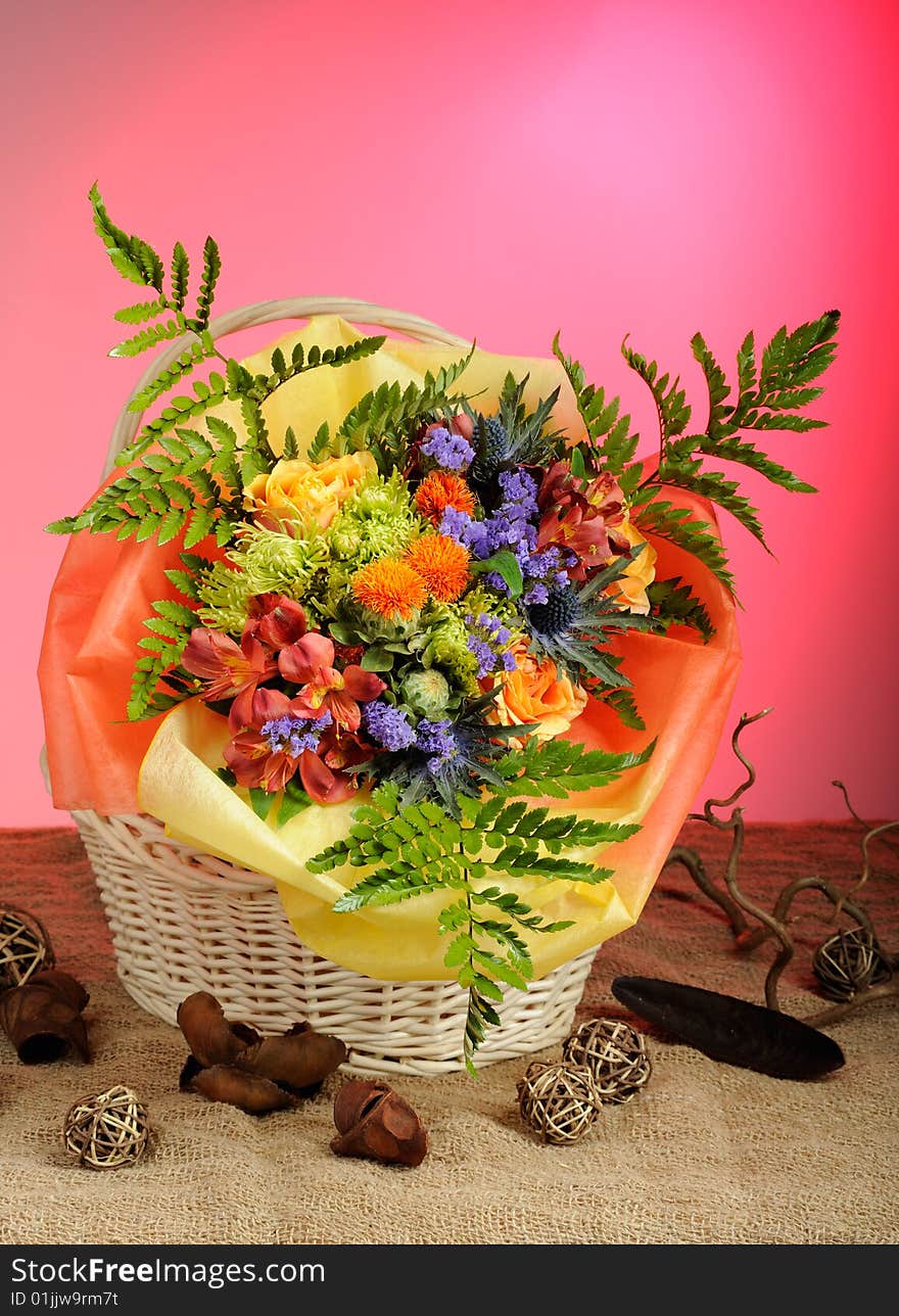 Bunch of flowers in wicker basket