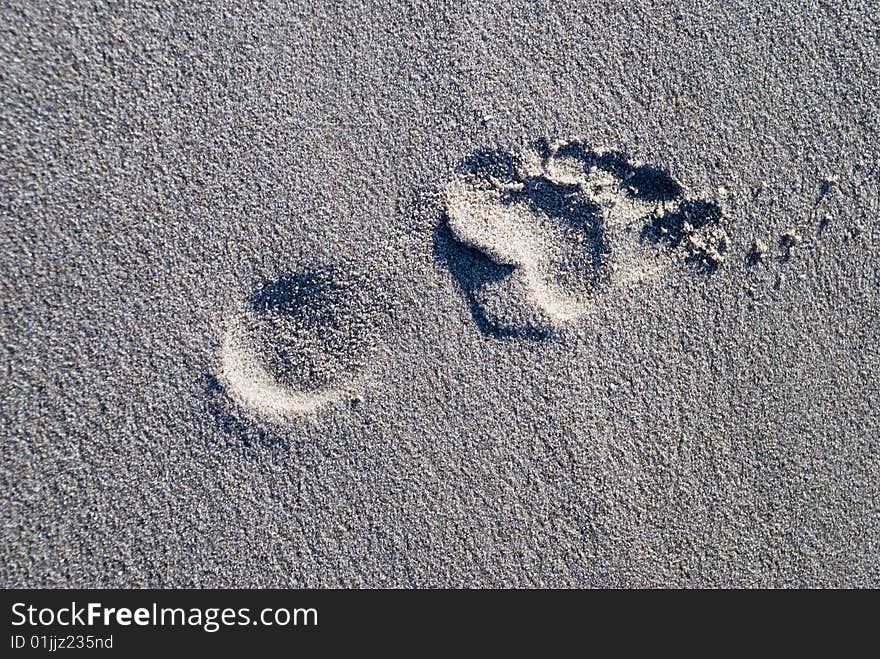 A lonely footprint in the sand