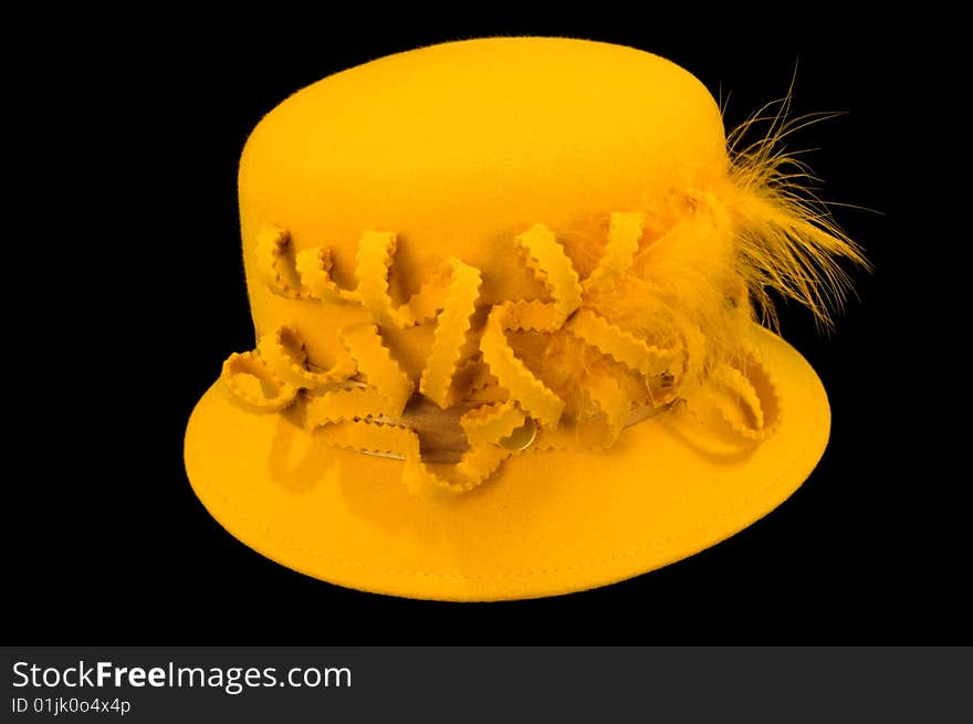 Female yellow hat on a black background. Female yellow hat on a black background.