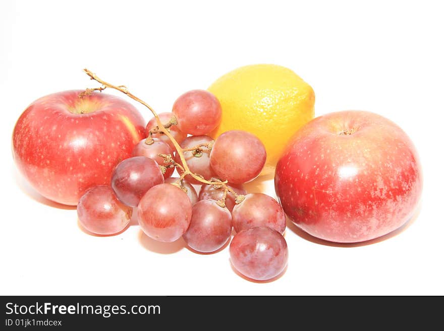 Grapes and apples on a white background. Grapes and apples on a white background