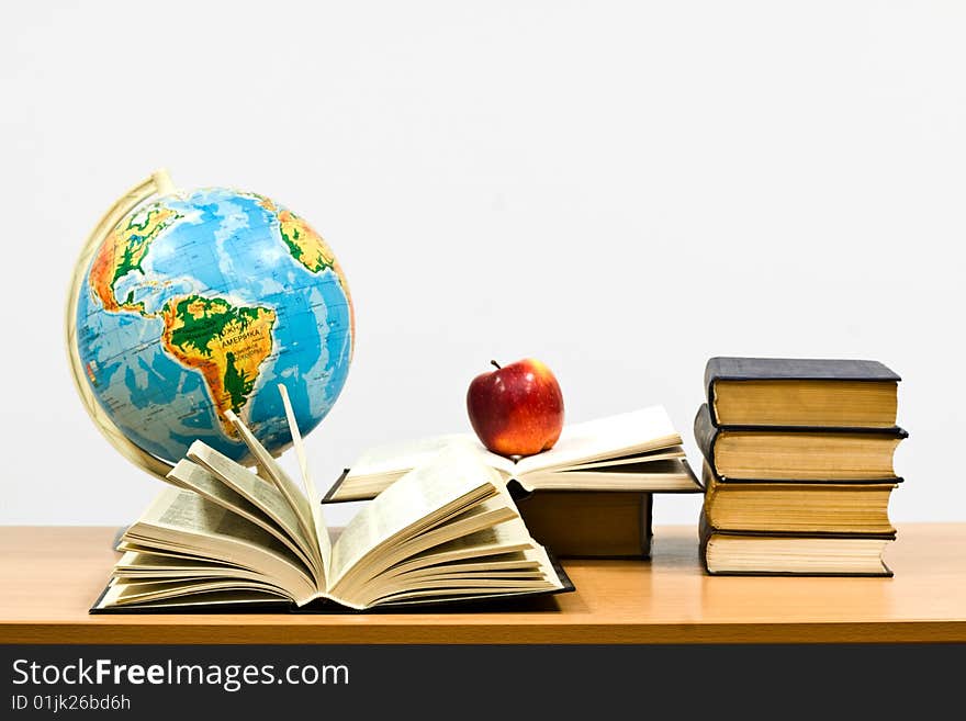 Books on a table on a white background. Books on a table on a white background