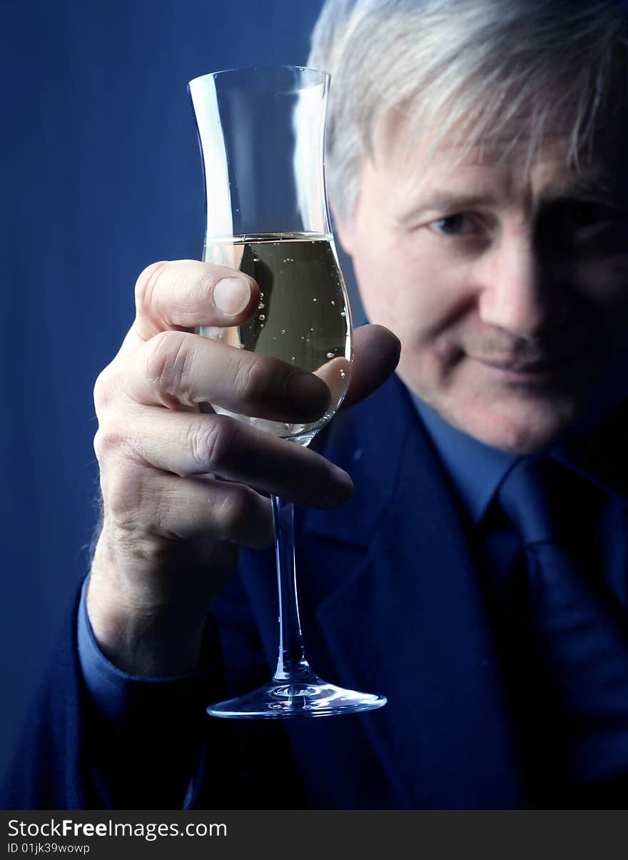 Portrait of a senior man with a glass of wine. Portrait of a senior man with a glass of wine