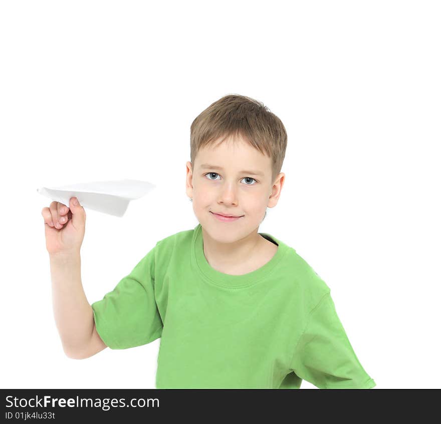 Smiling boy starts paper plane