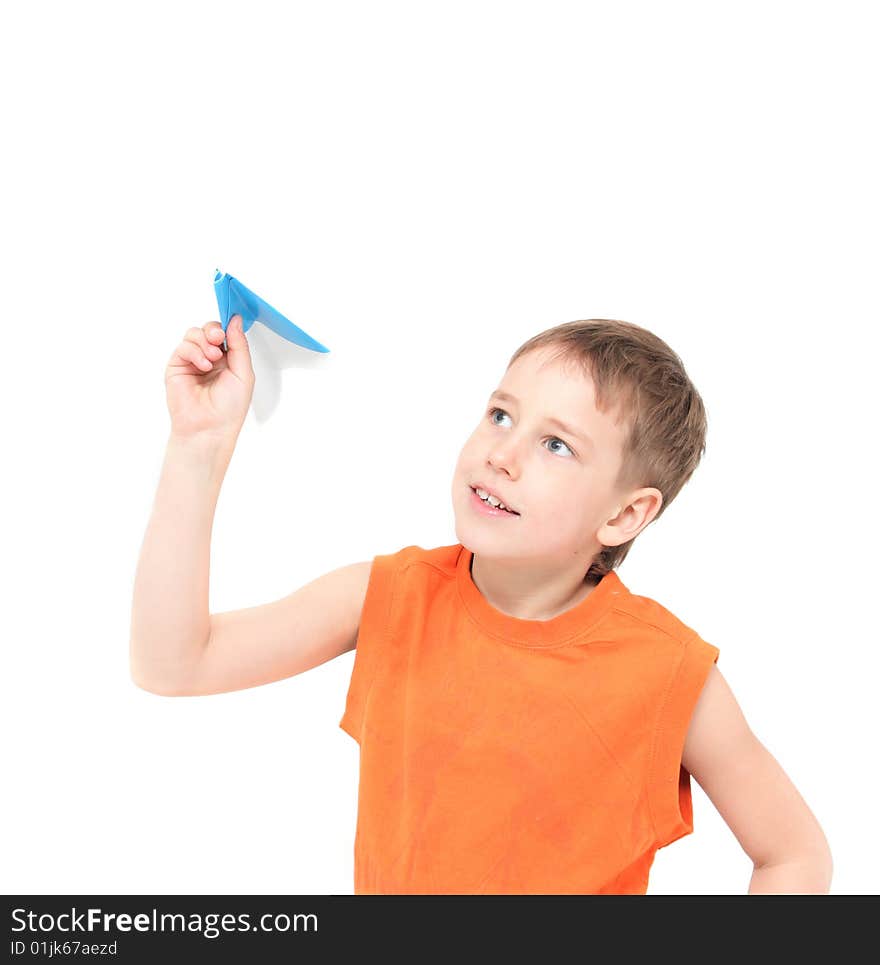 Smiling boy starts paper plane