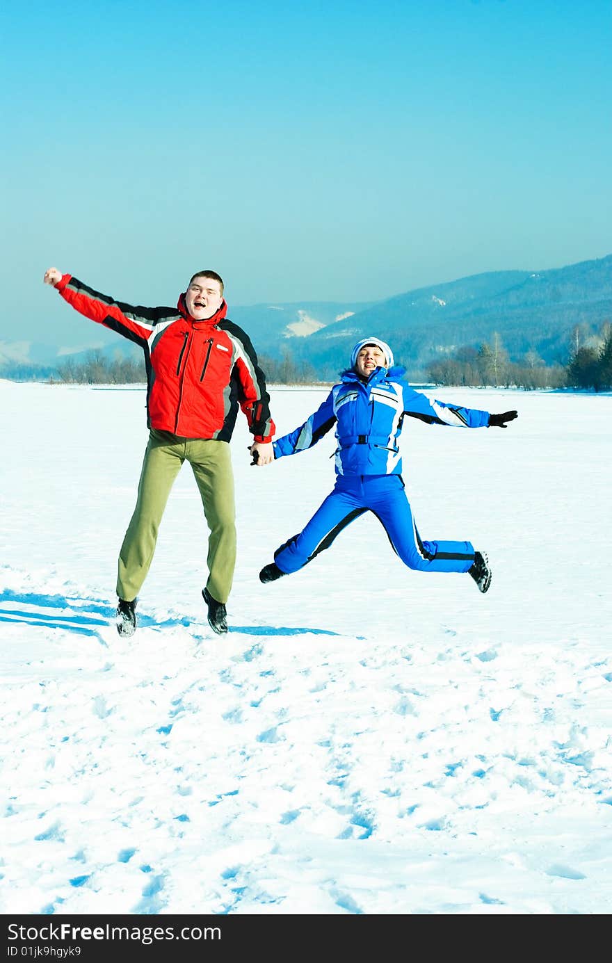 Happy jumping couple