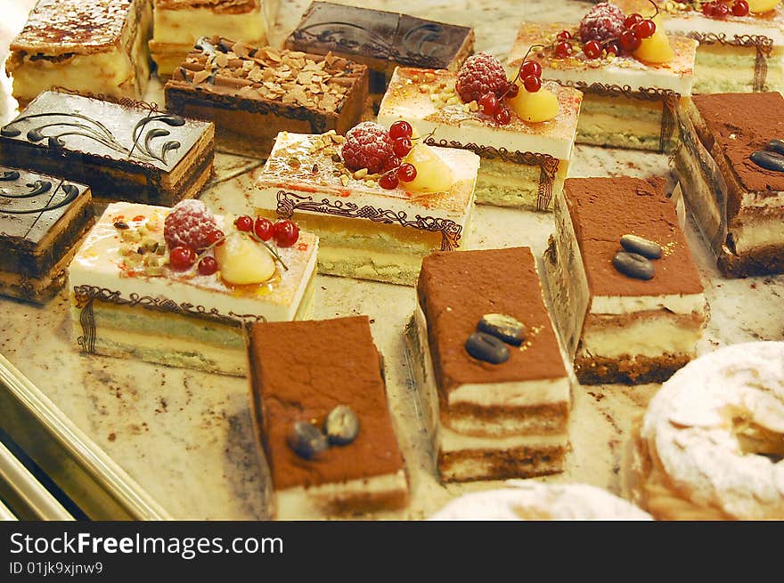 Various small cakes in a confectionery. Various small cakes in a confectionery.