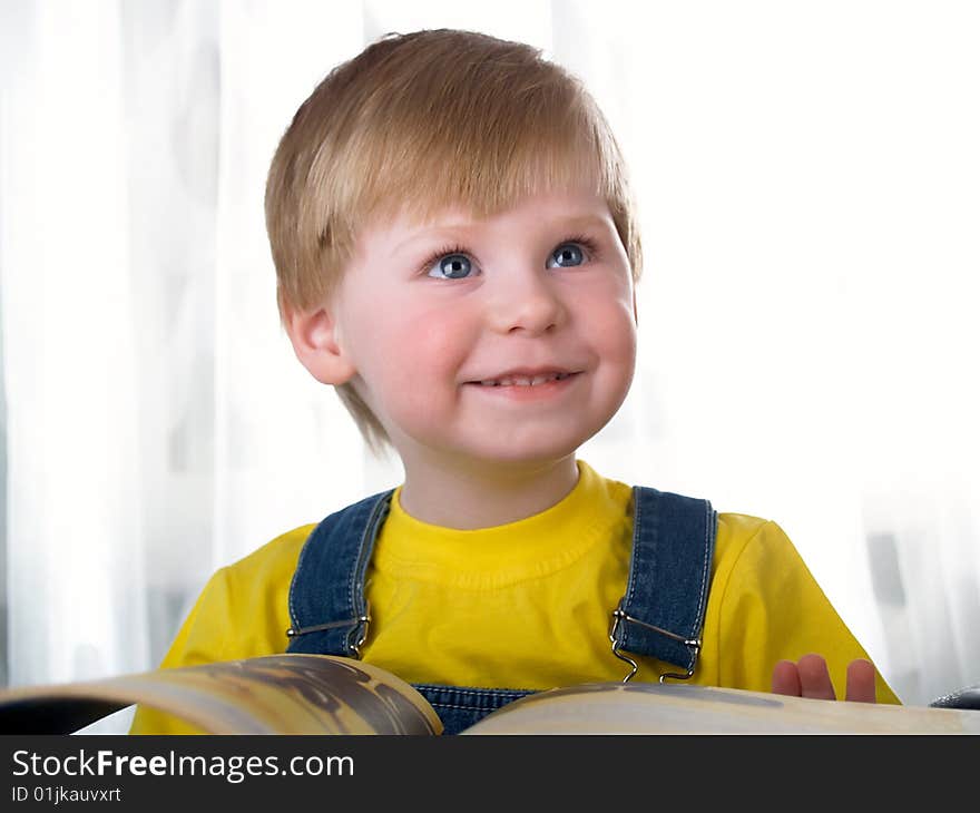 The child with books on the white background