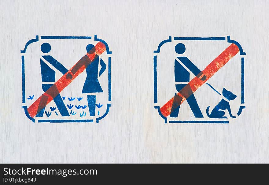 Forbidding pictograms on board in park. Forbidding pictograms on board in park