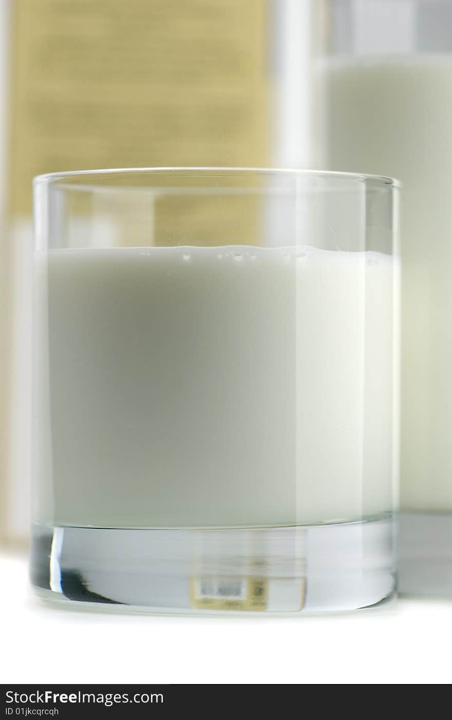 Glass of milk and fresh cookies on a white background. Glass of milk and fresh cookies on a white background