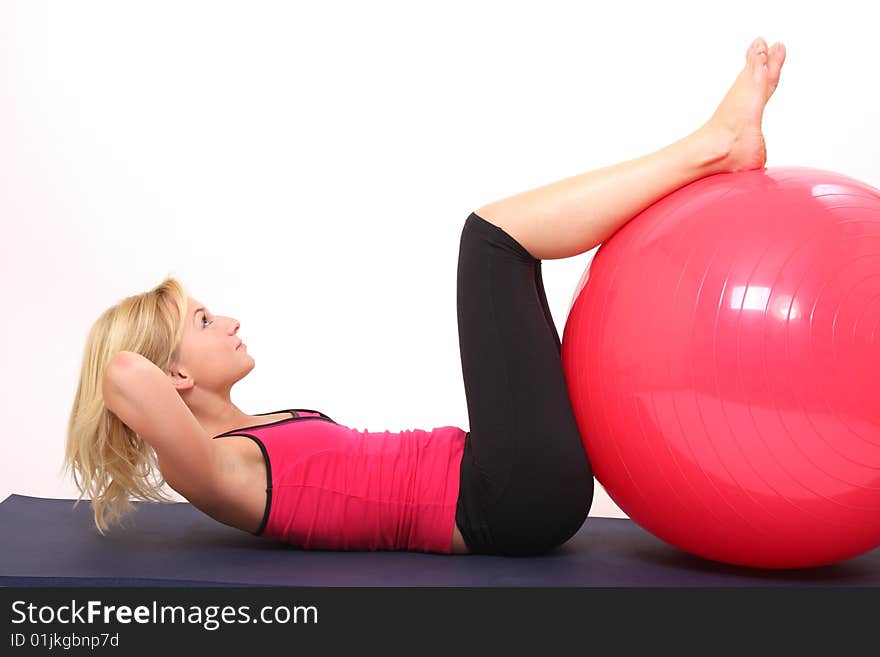 Young woman doing exercise with fit-ball. Young woman doing exercise with fit-ball