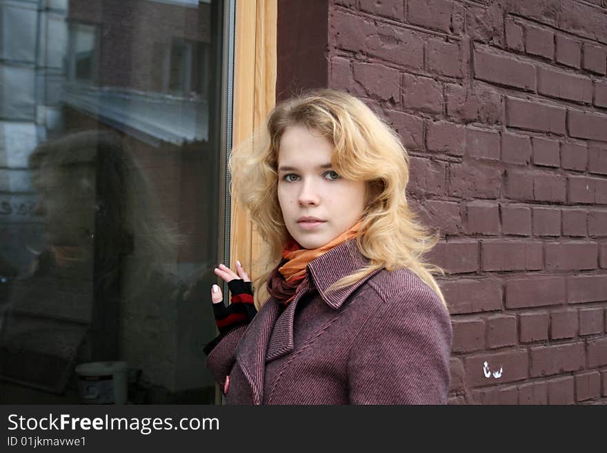 Girl standing near a window