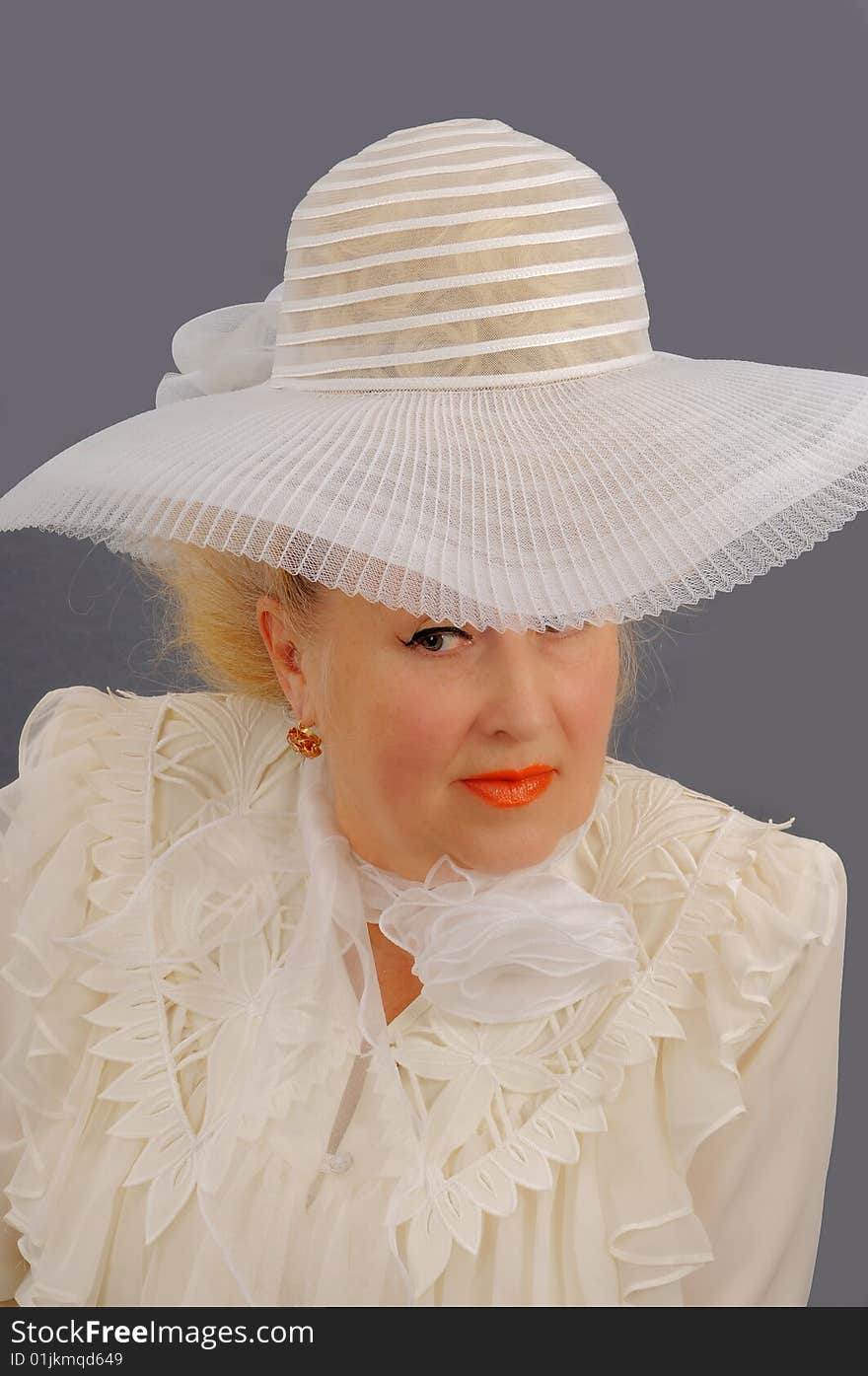 The blonde in a white hat.