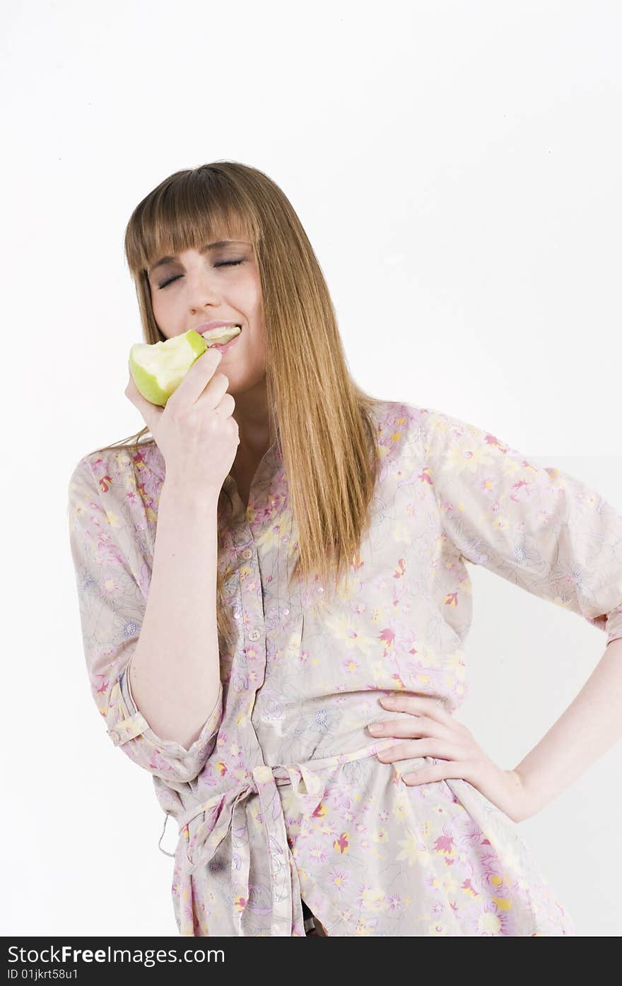 Young blue eyes girl with green apple. Young blue eyes girl with green apple.