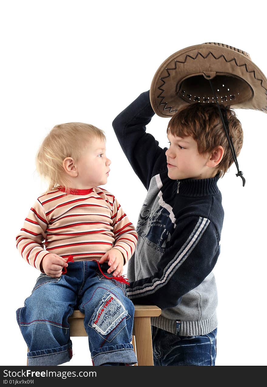 Two little boys (brothers) isolated on white background