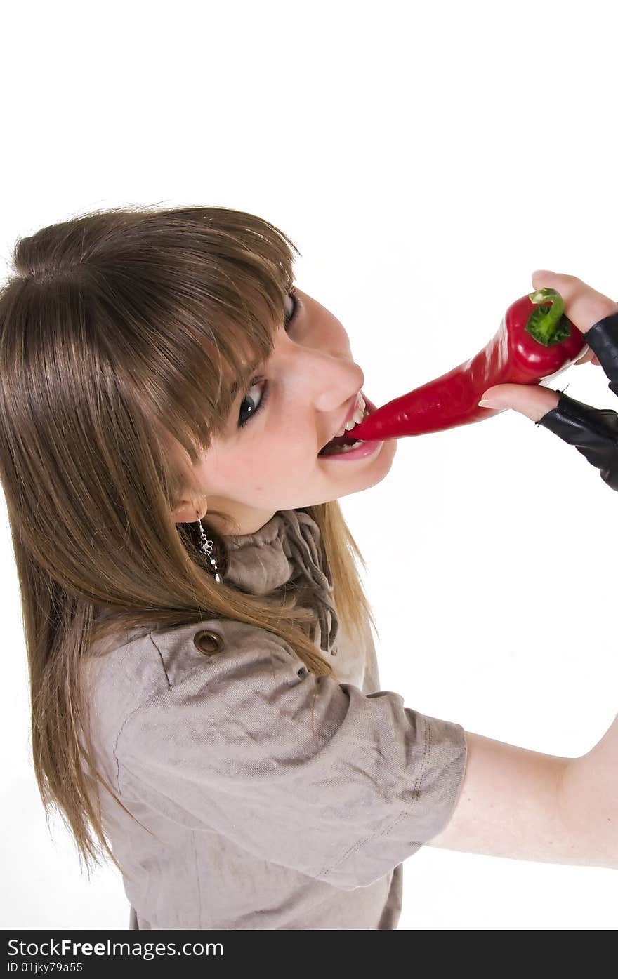 Young blue eyes girl with red  paprika in hand. Young blue eyes girl with red  paprika in hand.