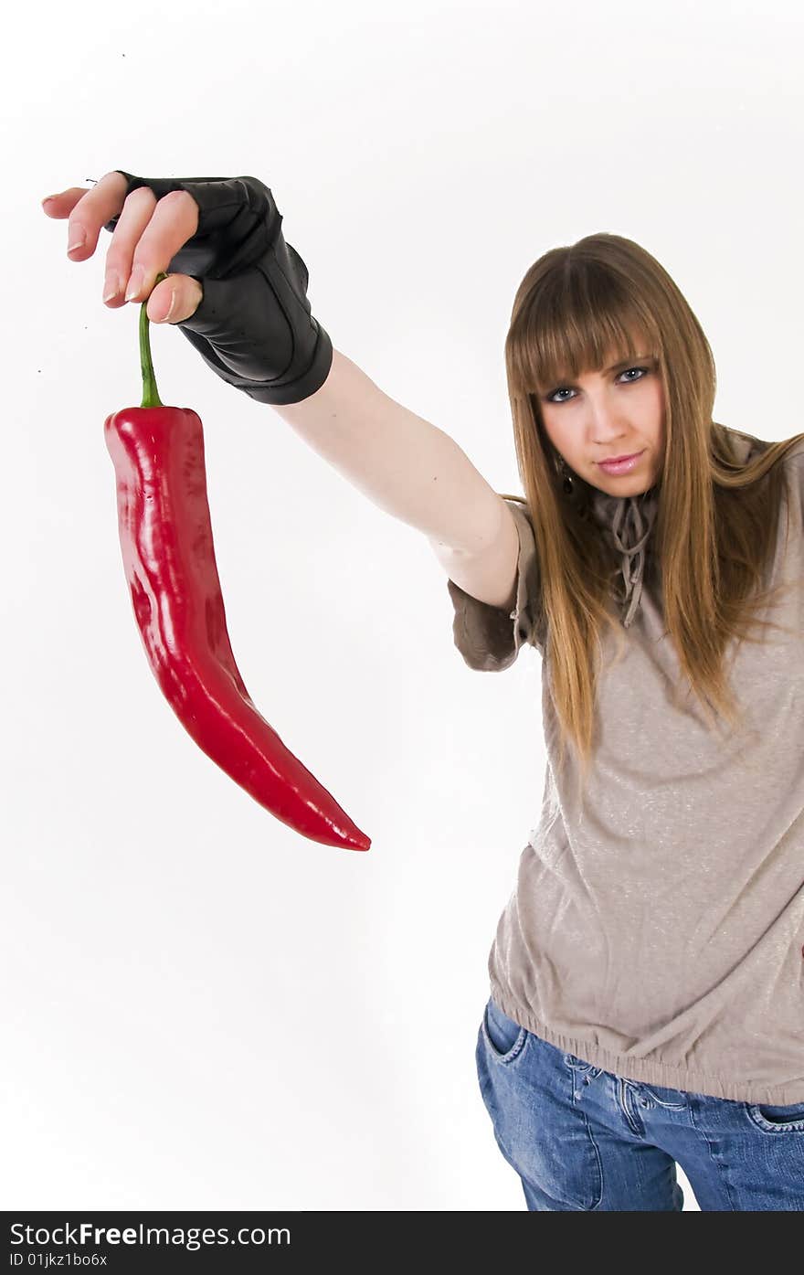 Young blue eyes girl with red  paprika in hand. Young blue eyes girl with red  paprika in hand.