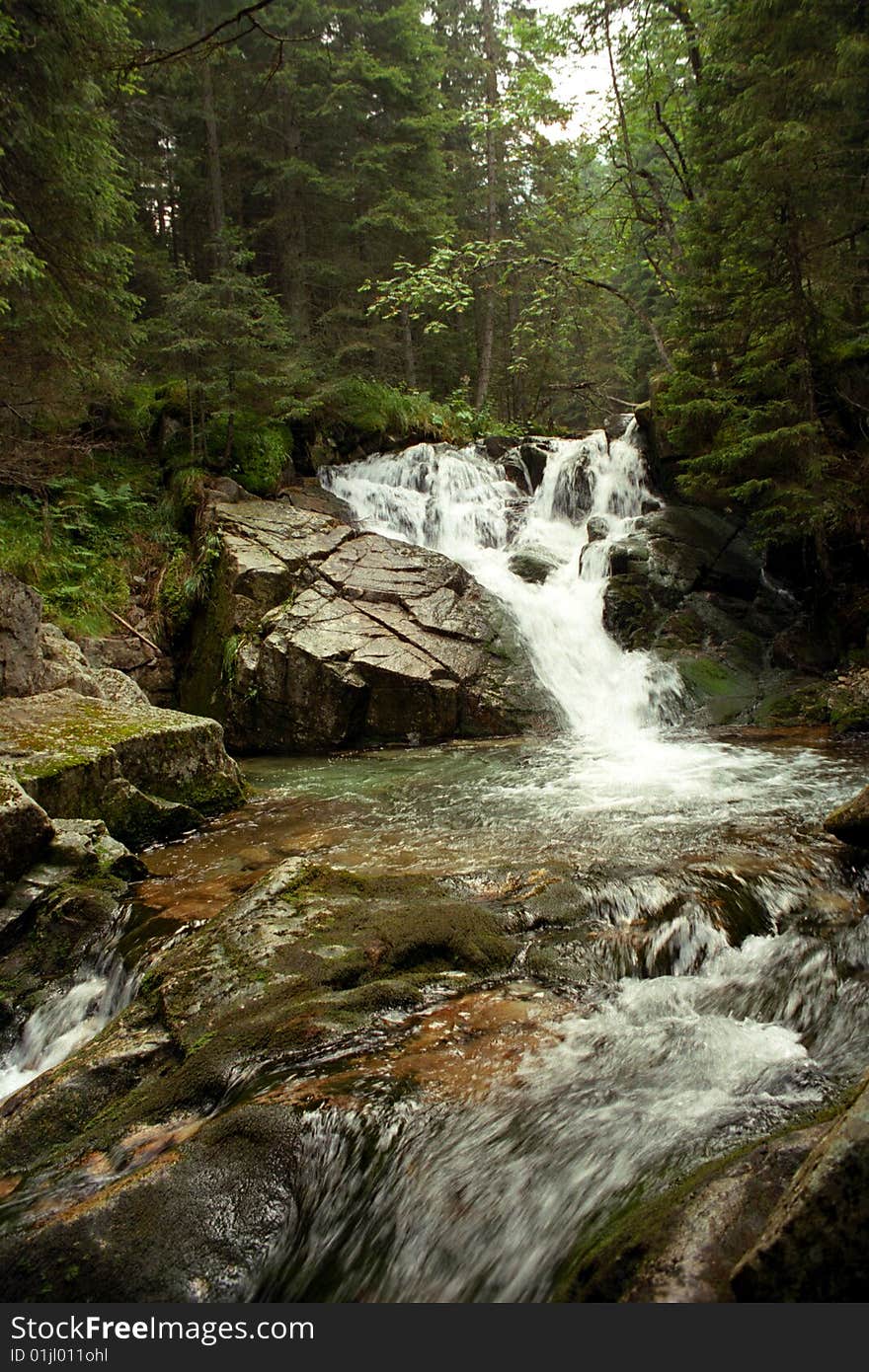 Running water, small mountain stream and small waterfall