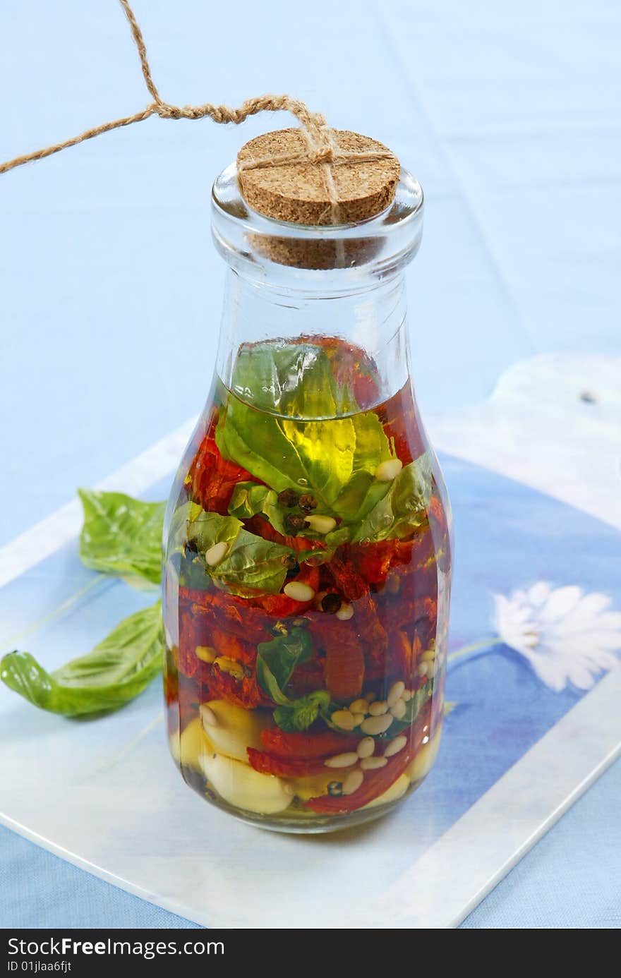 Marinated vegetables in glass bottle