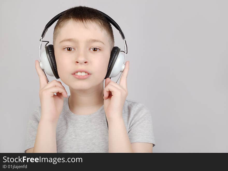 Boy in headphones with copy space. Boy in headphones with copy space