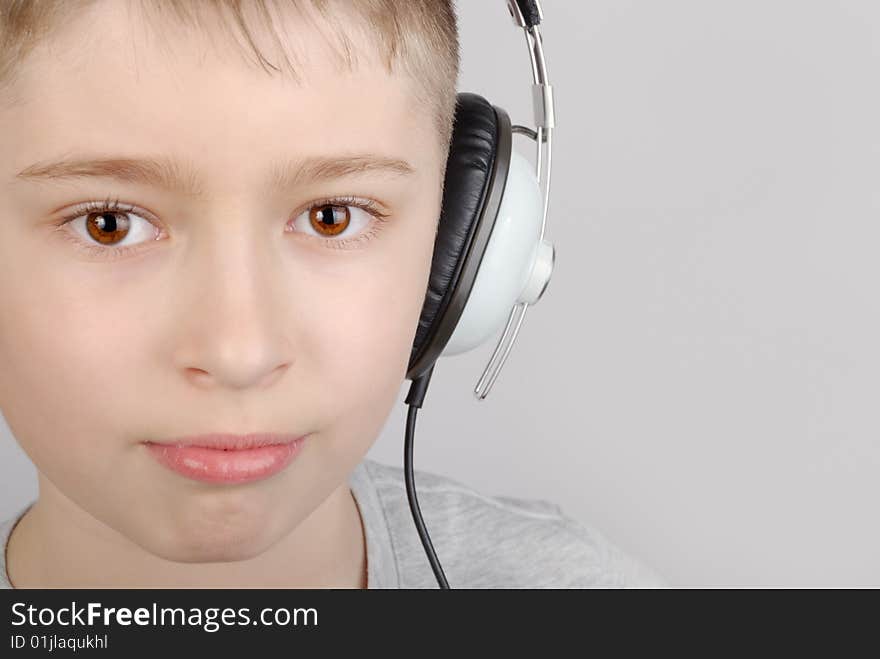 Boy in headphones with copy space. Boy in headphones with copy space