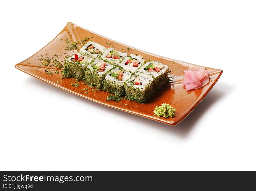 Rolls with dill, tuna and tofu in brown squared plate over white background