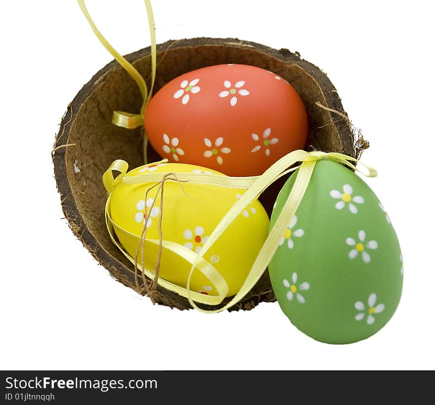 Basket full of Easter eggs - red green yellow.