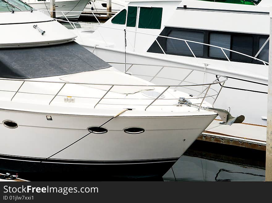 Two luxury boats in a marina