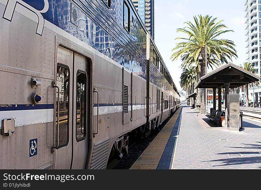 A trans-continental railroad train at a station