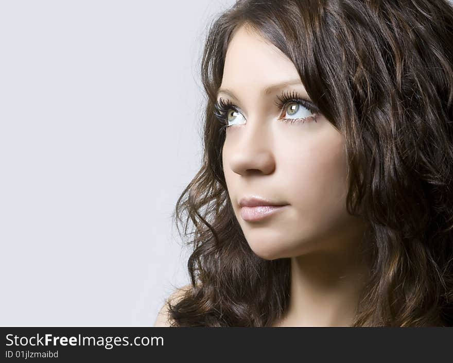 Close-up portrait of a beautiful young brunette. Close-up portrait of a beautiful young brunette