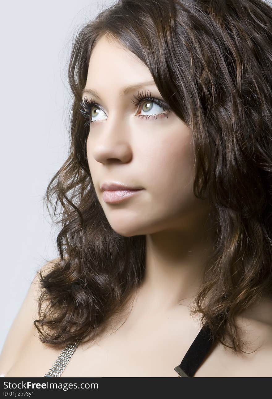 Close-up portrait of a beautiful young brunette. Close-up portrait of a beautiful young brunette