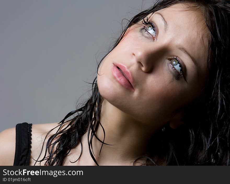 Beautiful wet brunette portrait in studio shot