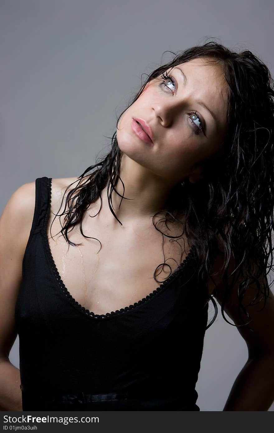 Beautiful wet brunette portrait in studio shot