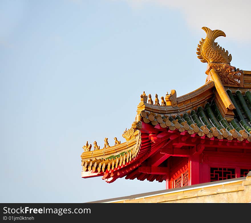 Traditional detail of a chinese roof with guarding lions and warriors