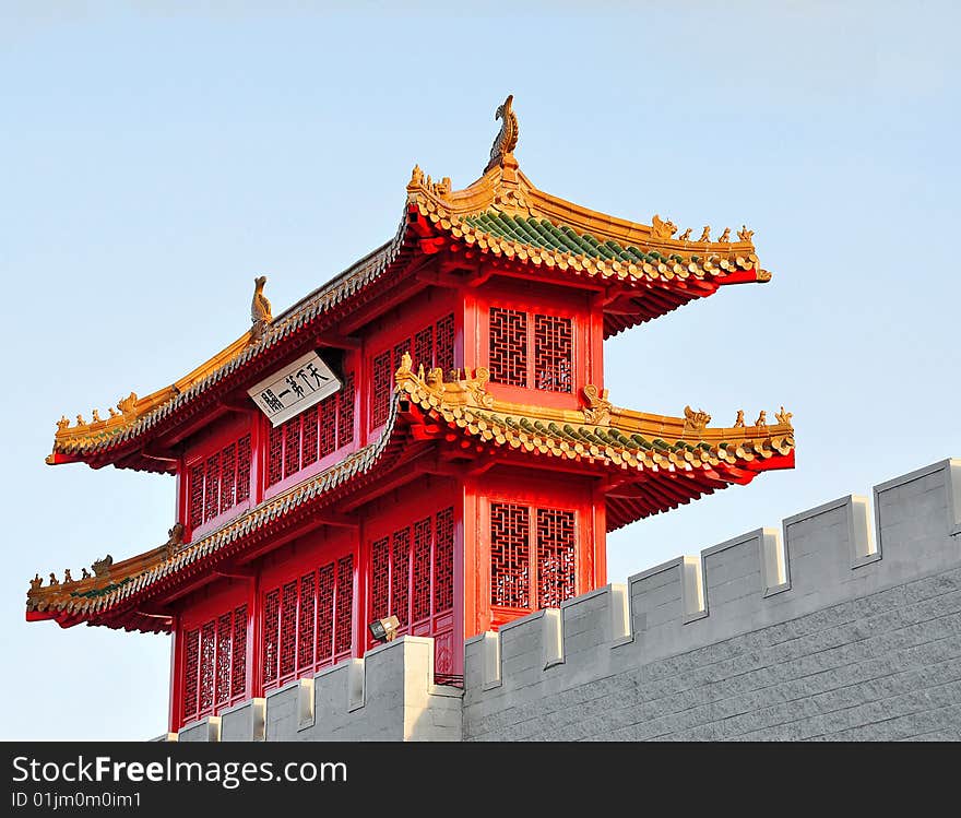 Traditional detail of a chinese roof with guarding lions and warriors