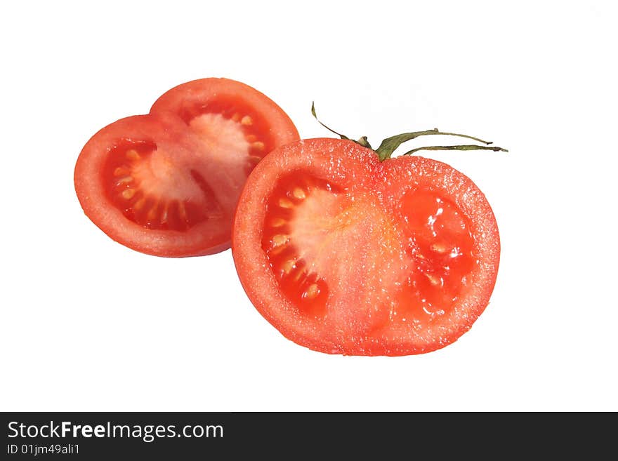 Half of fresh tomato of red color on a white background.