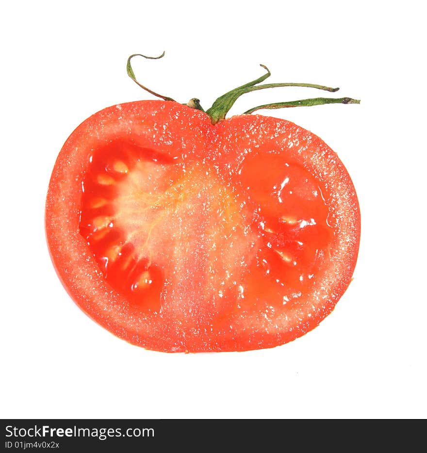 Half of fresh tomato of red color on a white background.