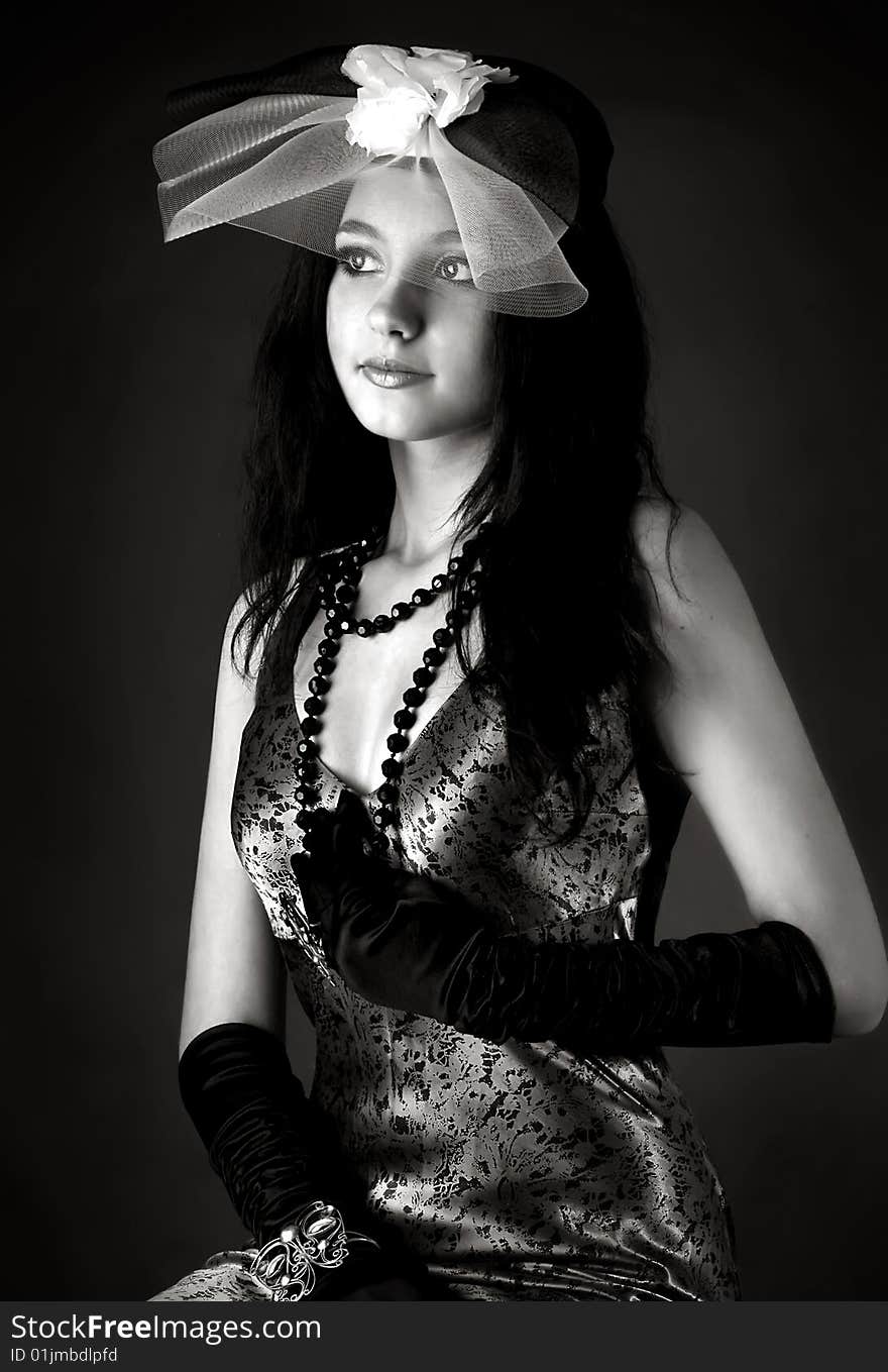 Series. Portrait of the beautiful brunette in a dark blue dress