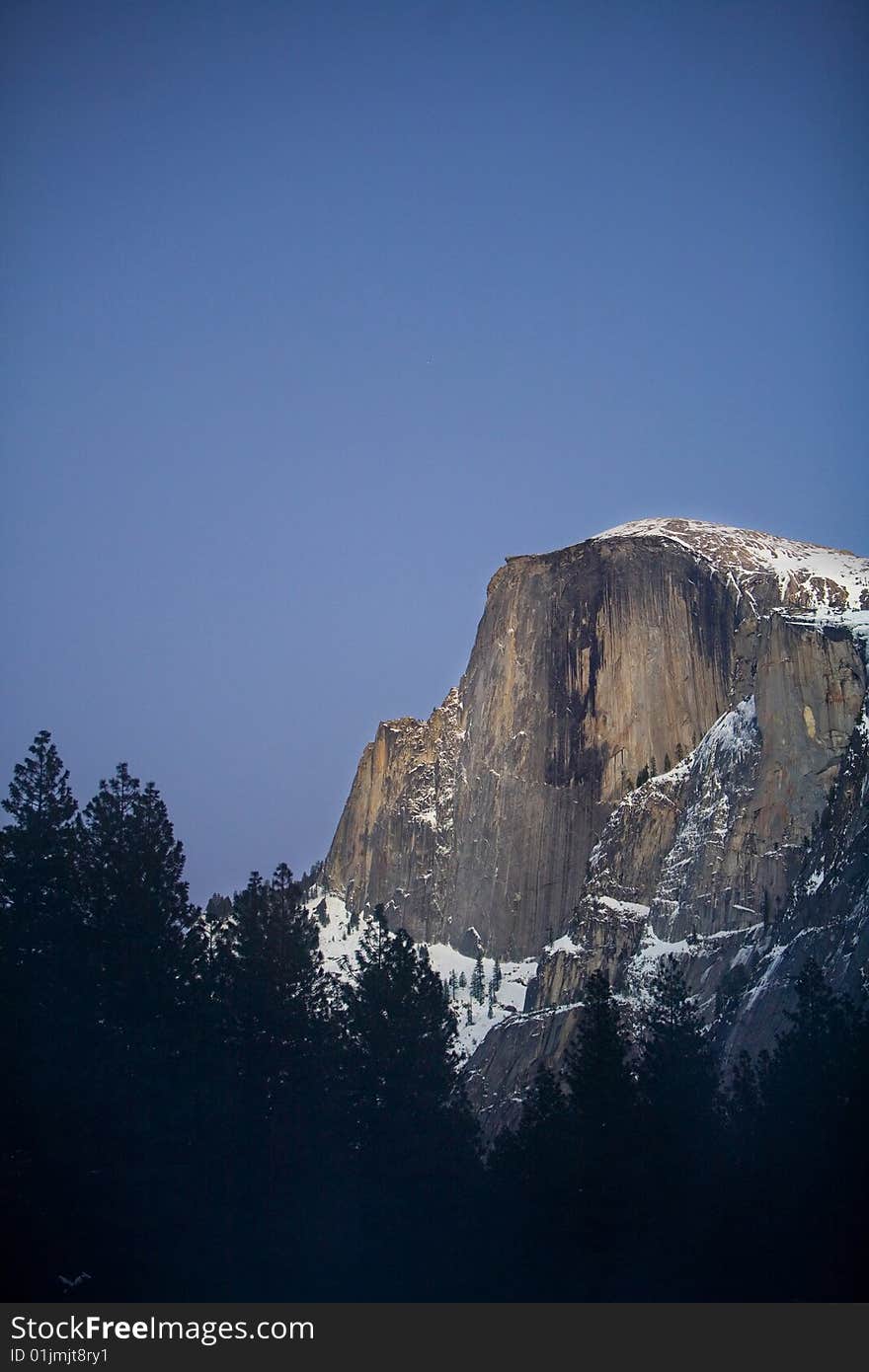 Half Dome in Yosemite National Park during winter in twilight. Half Dome in Yosemite National Park during winter in twilight