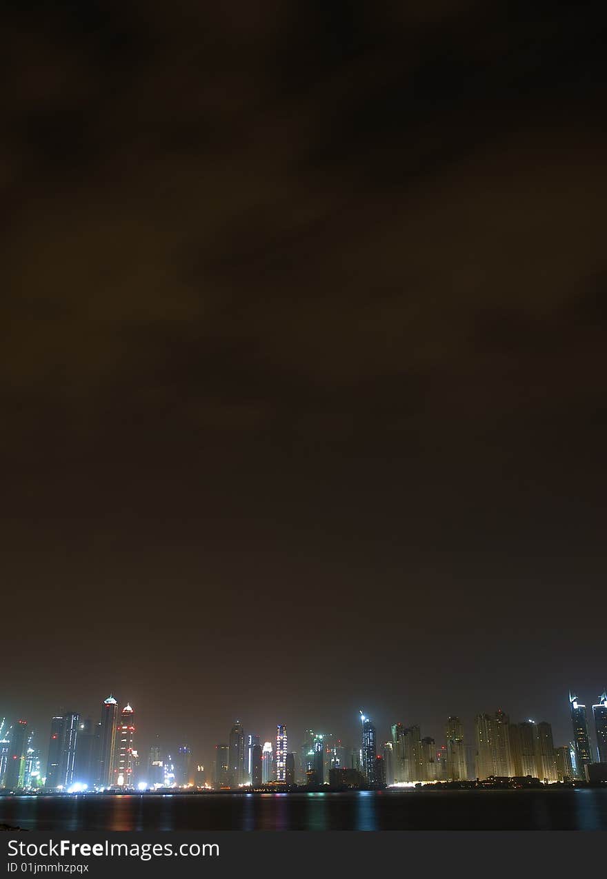 View of dubai marina through the fog from the palm island