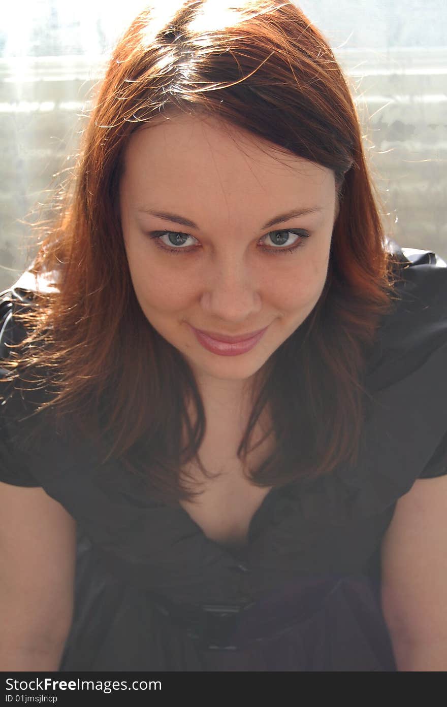 Beautiful young woman in black dress