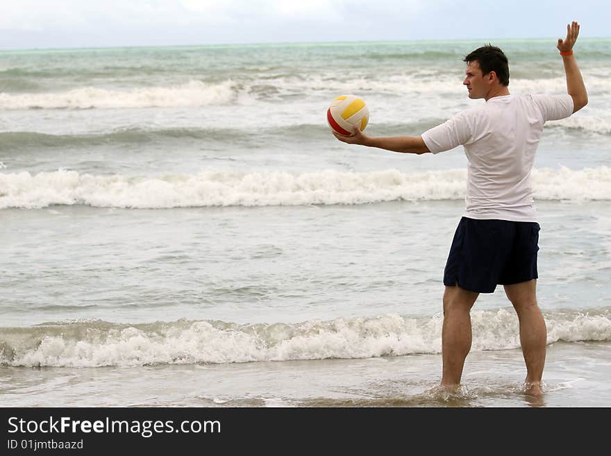 Man holding volleyball and inviting to play. Man holding volleyball and inviting to play