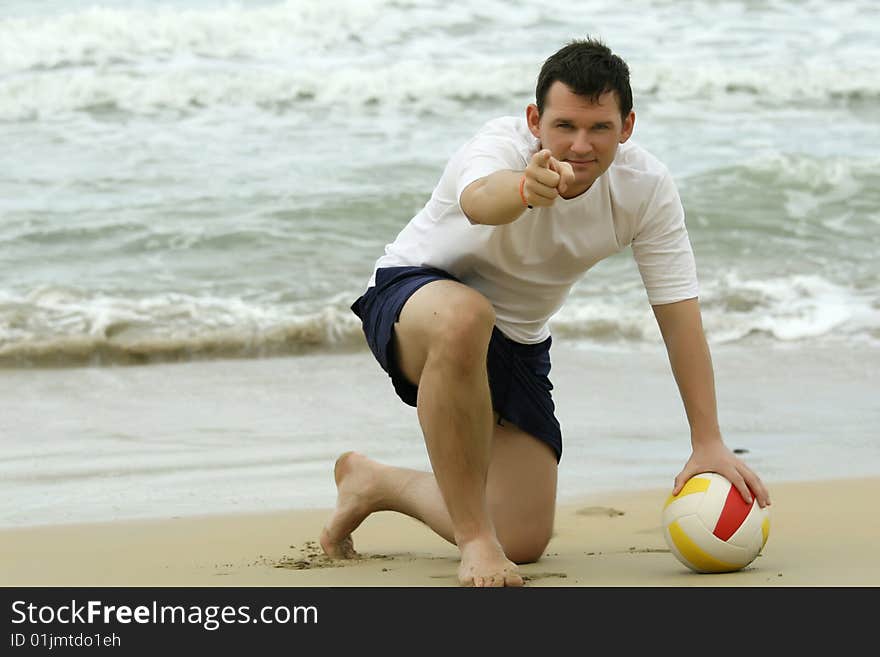 Man holding volleyball and inviting to play. Man holding volleyball and inviting to play