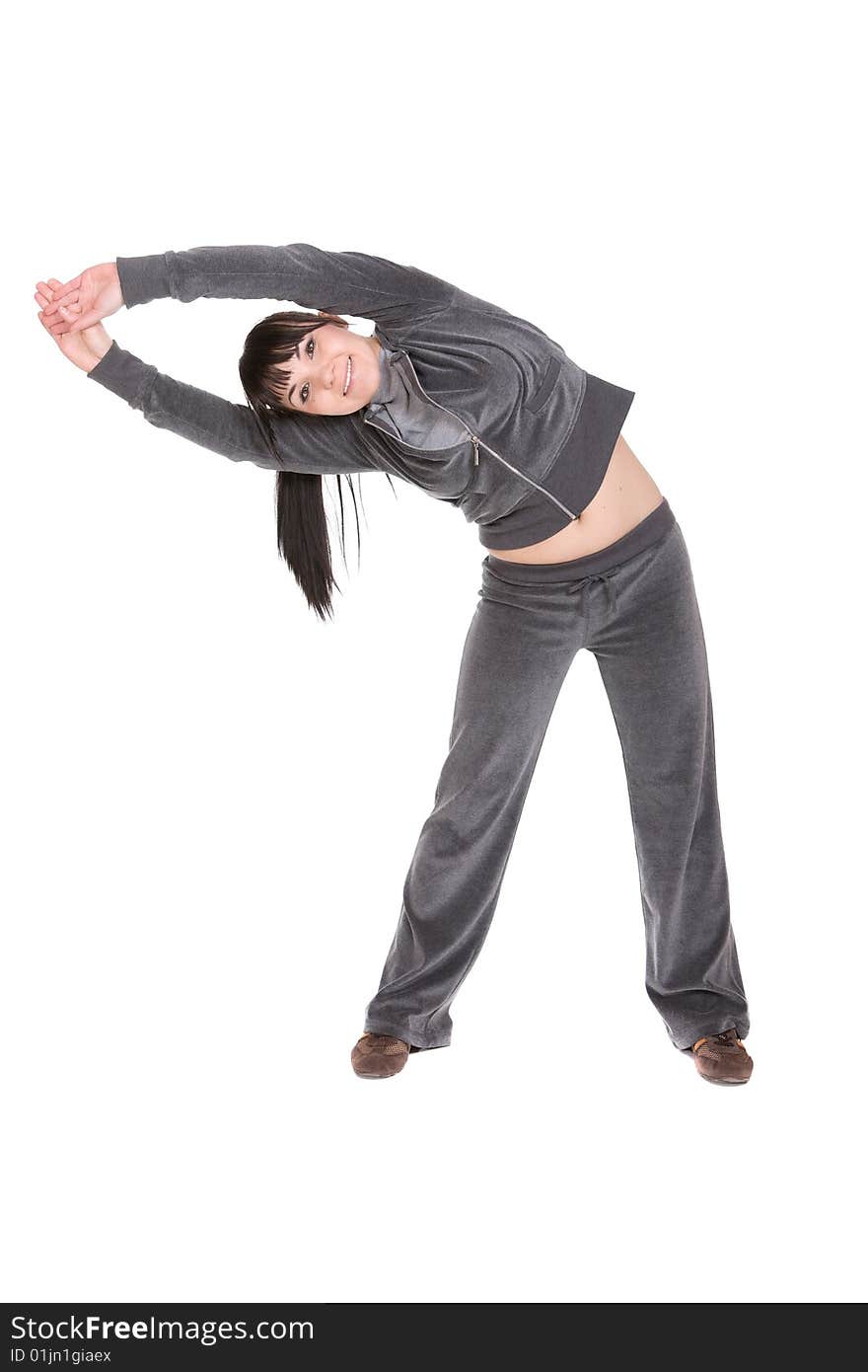 Attractive brunette woman doing exercise. over white background