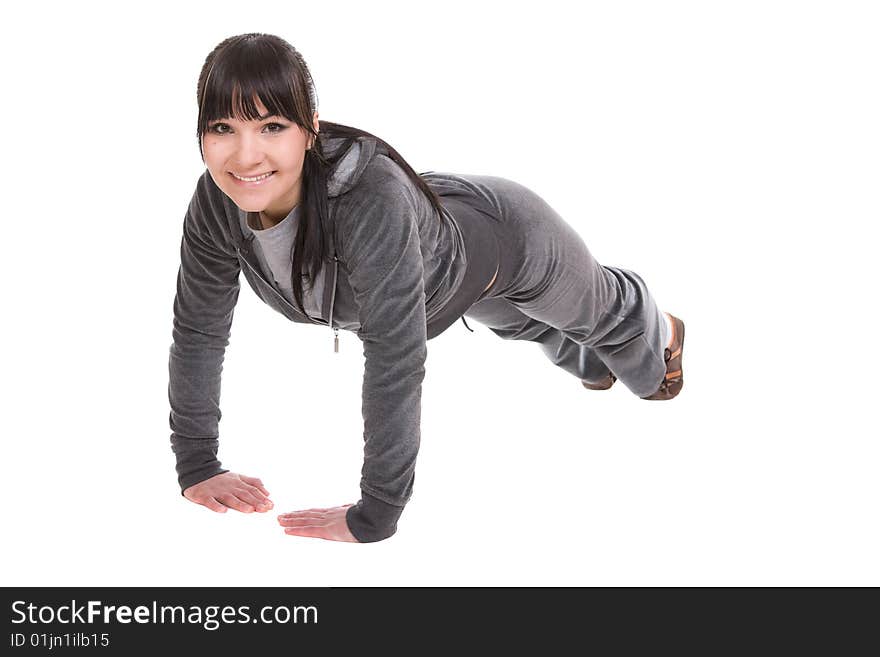 Attractive brunette woman doing exercise. over white background