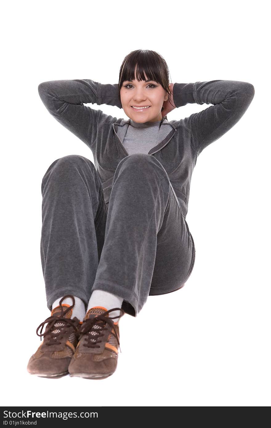 Attractive brunette woman doing exercise. over white background