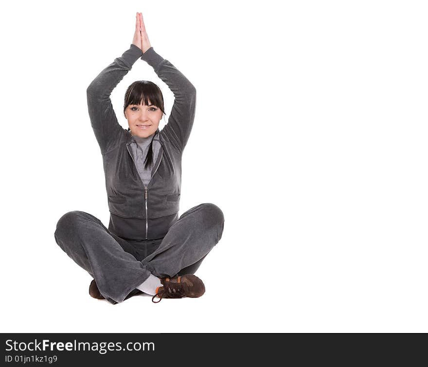 Attractive brunette woman doing exercise. over white background