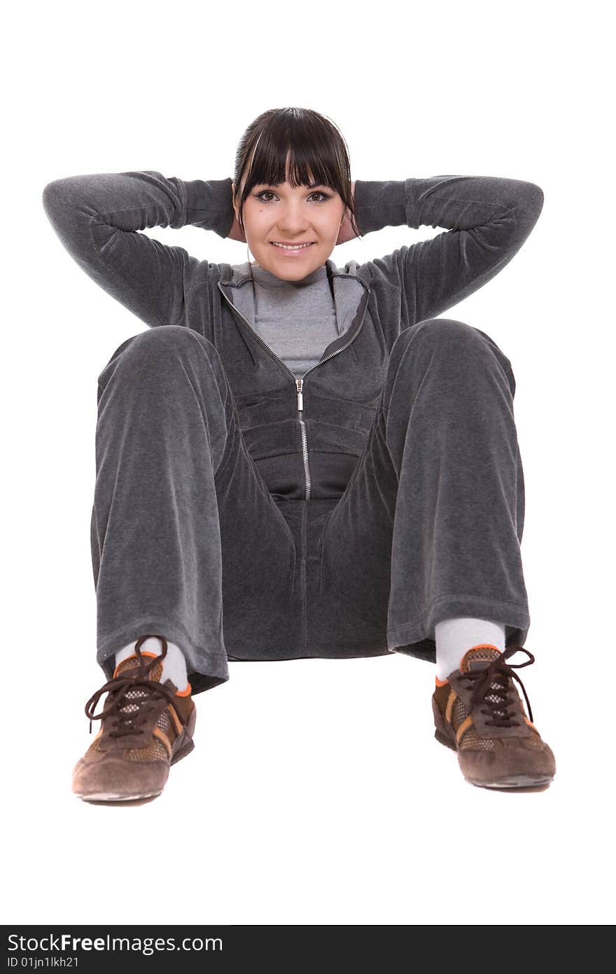 Attractive brunette woman doing exercise. over white background